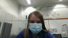 Blonde hair blue mask purple jacket and blue eyes.